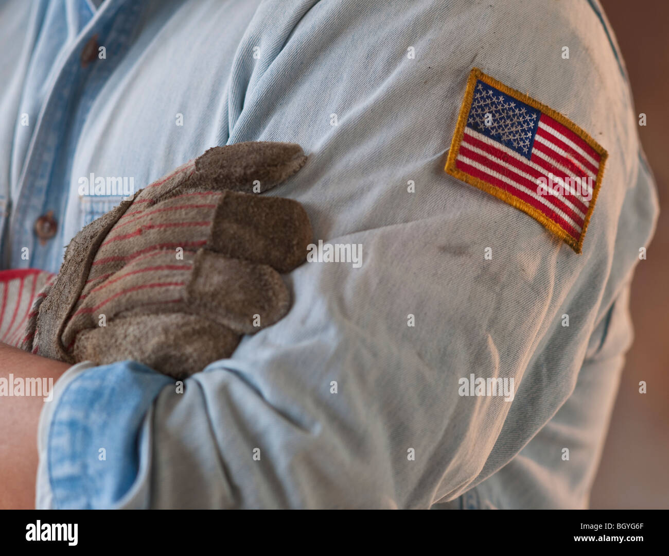Blue collar working wearing American flag patch Stock Photo