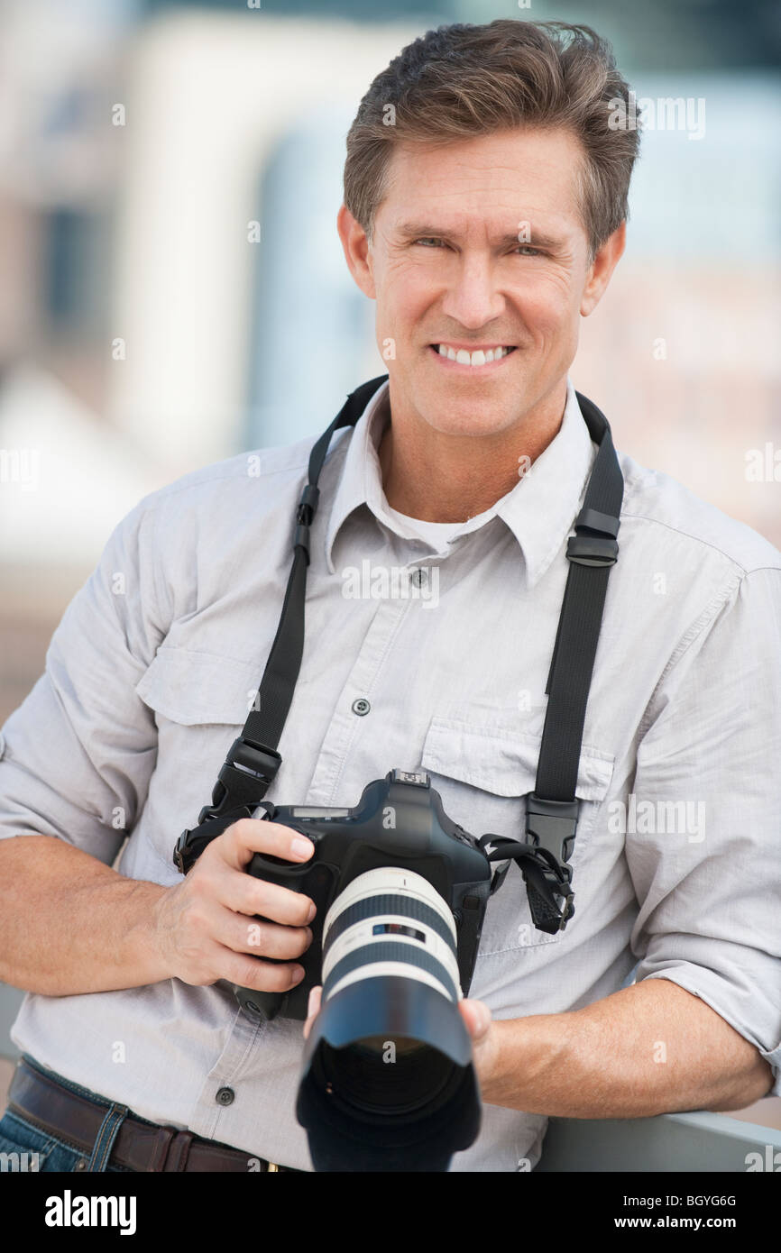 Man with camera Stock Photo