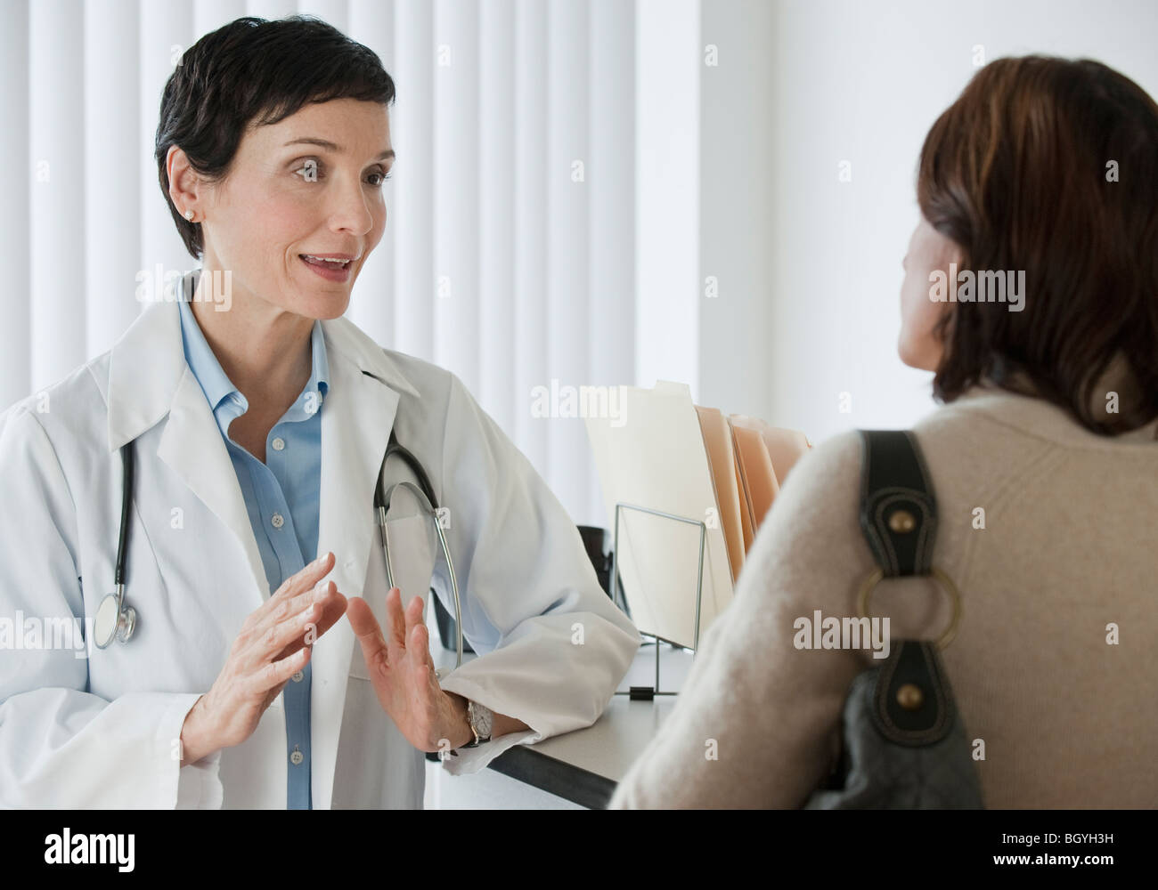 Doctor talking to patient Stock Photo