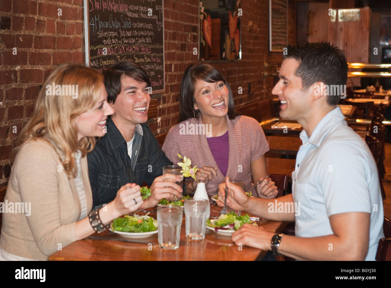 Friends eating at restaurant Stock Photo