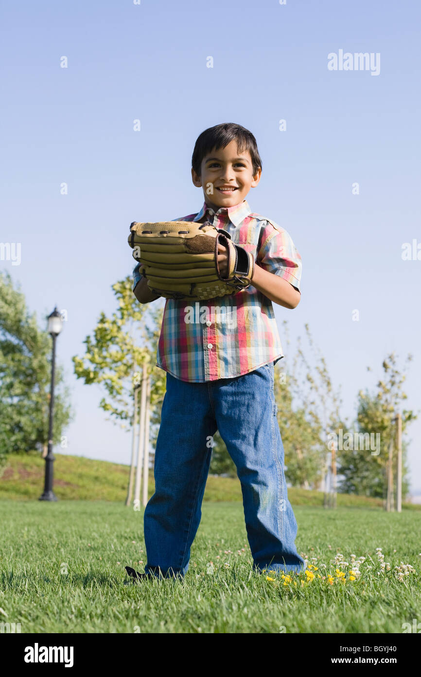 Boy wearing baseball glove Stock Photo Alamy