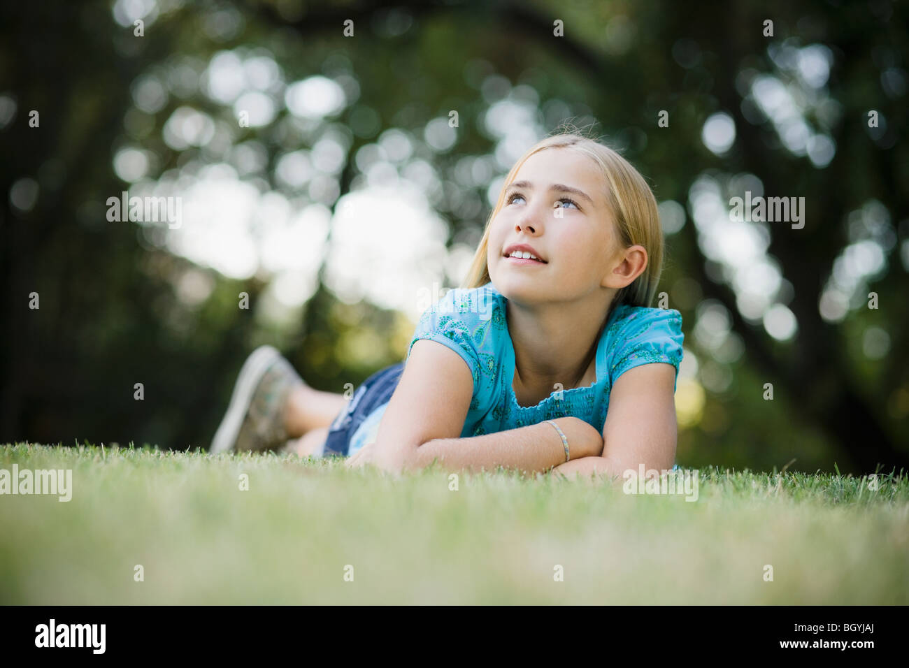 Young girl lying on grass Stock Photo