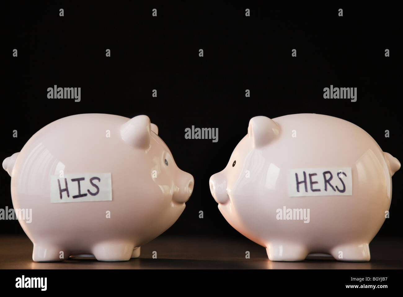 His and hers piggy banks Stock Photo
