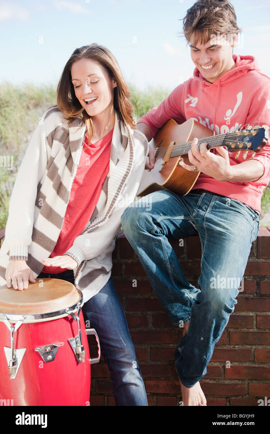 Couple playing instruments Stock Photo
