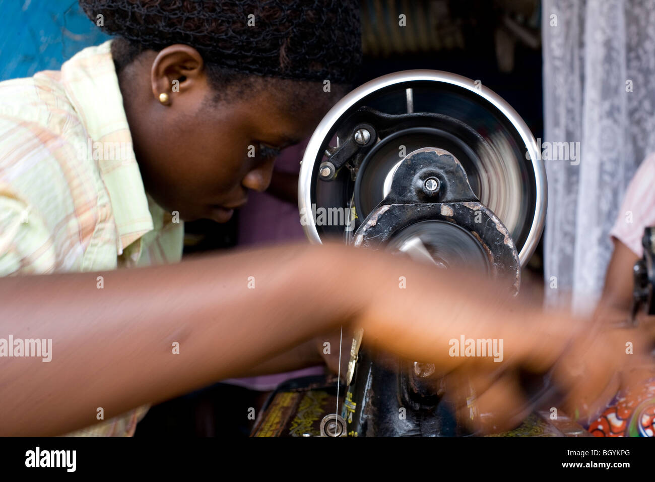 Young seamstress in Ghana, Africa Stock Photo
