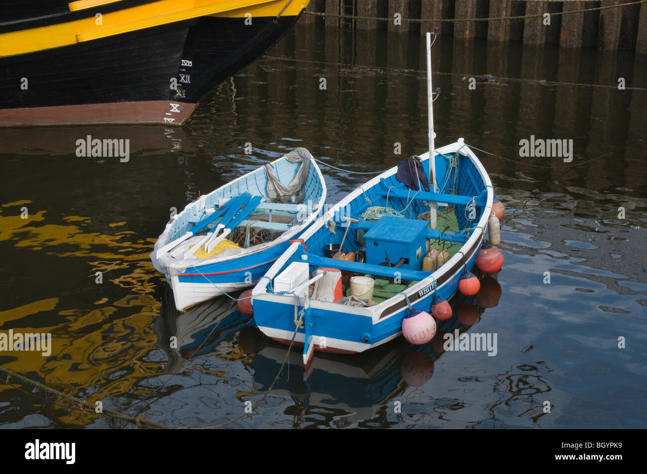 Two small fishing boats moored in Whitby harbour Stock Photo - Alamy