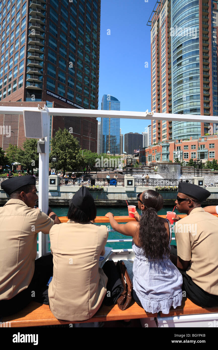 Four people on boat during architectural river tour, Chicago, Illinois