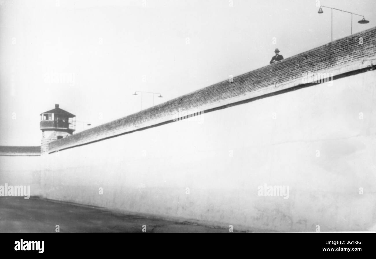 Prison warden on perimeter fence of his prison. Nebraska State Penitentiary. Ca 1950s. Lincoln, Nebraska, USA. Stock Photo