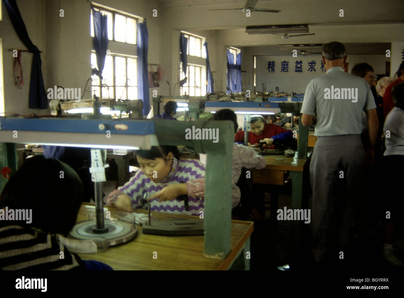 Chinese workers make hand made goods in October 1992. Stock Photo
