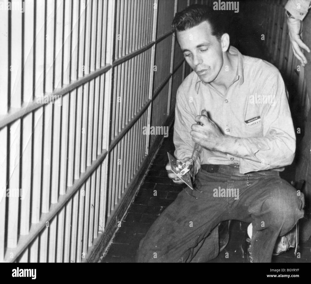 Inmate mending a caster. 40s to 50s. Nebraska State Penitentiary. Lincoln, Nebraska, USA. Stock Photo