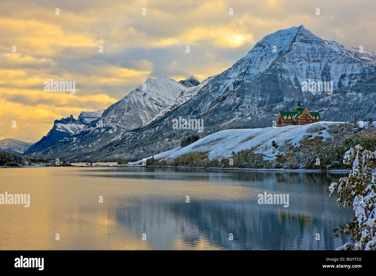 Prince of Wales Hotel overlooking Middle Waterton Lake after the first snowfall of winter, Waterton Lakes National Park (a UNESC Stock Photo