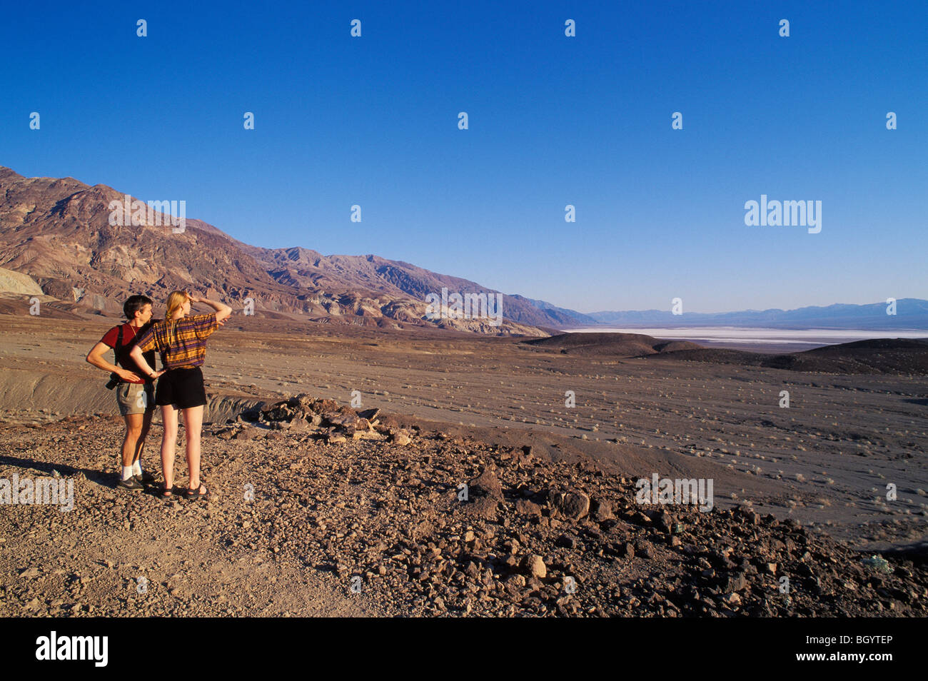 Visitors from Europe looking at the view from Artist's Drive to Badwater Basin in Death Valley National Park, California Stock Photo
