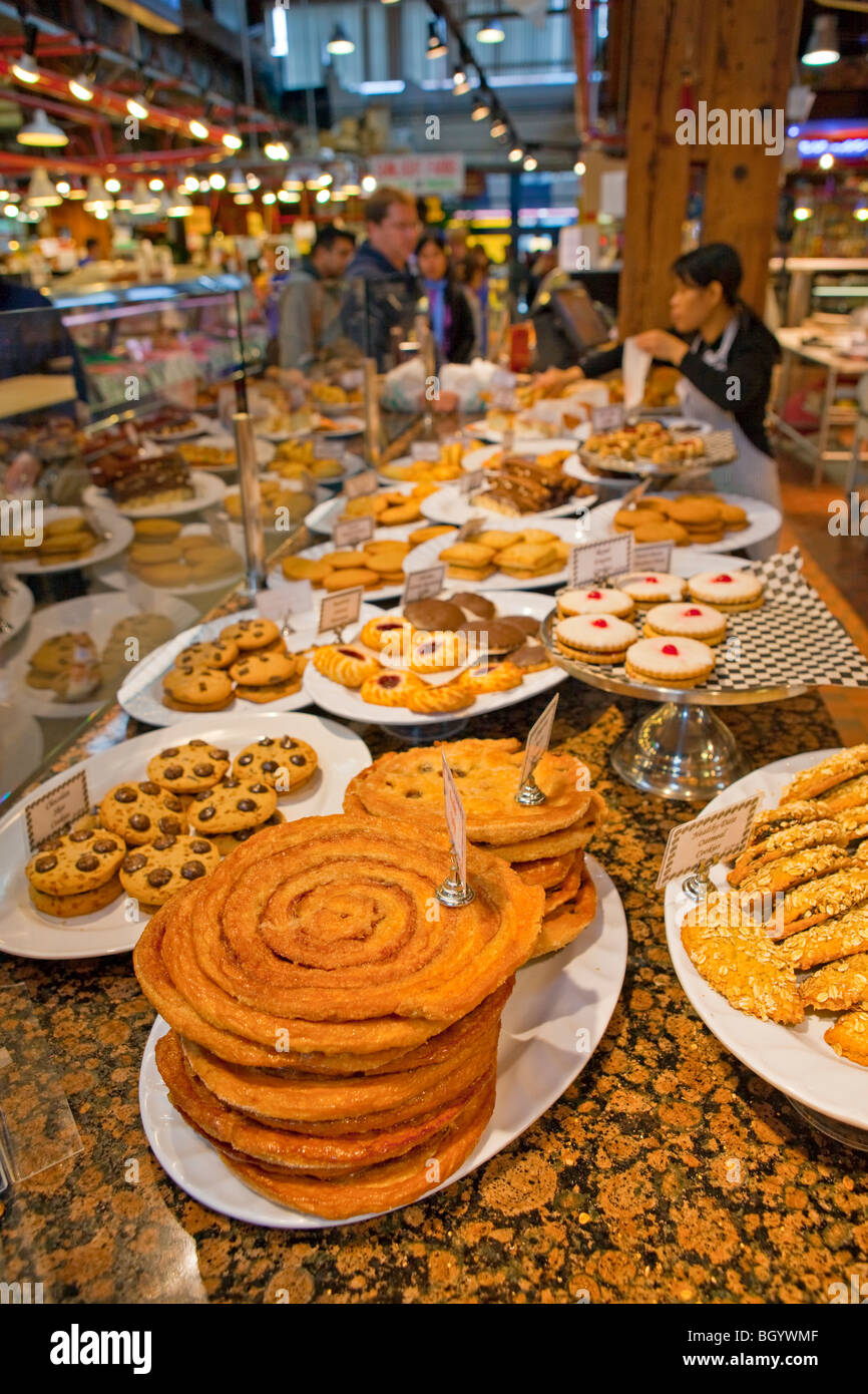 Baked goods on display at a market stall at the Granville Markets, Granville Island, Vancouver, British Columbia, Canada. Stock Photo