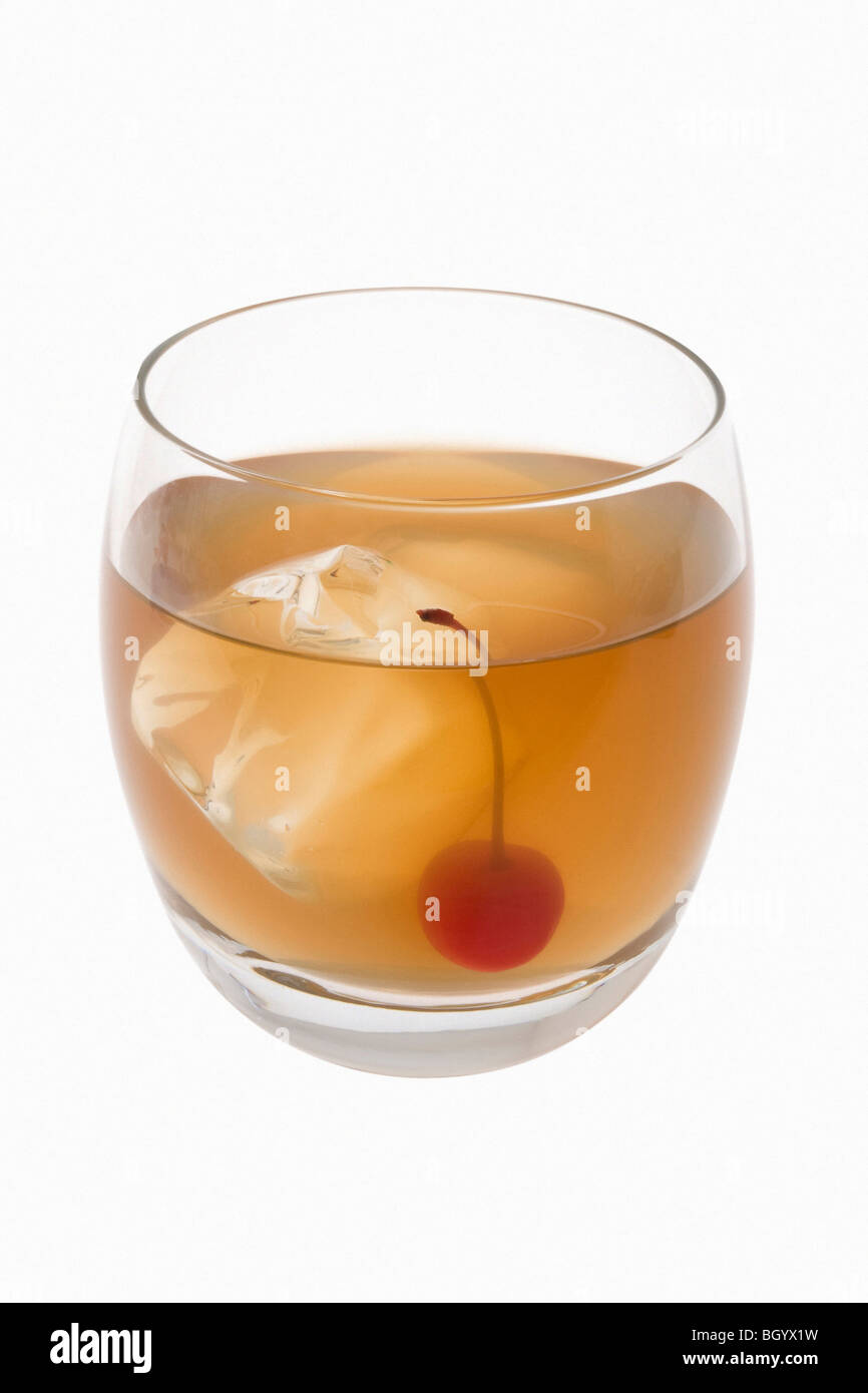 Whiskey Sour mixed drink with cherry garnish on white background Stock