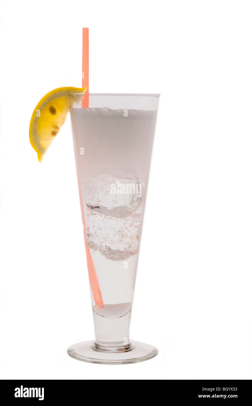 Vodka Seven or Tom Collins mixed drink with lemon slice garnish on white background Stock Photo