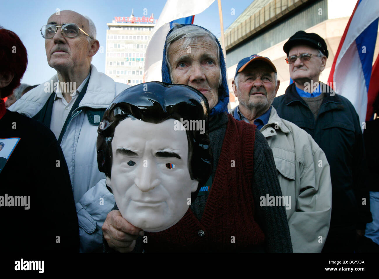 A Bosnian Serb shows a mask featuring the face of Bosnian Serb wartime leader Radovan Karadzic during a protest Stock Photo