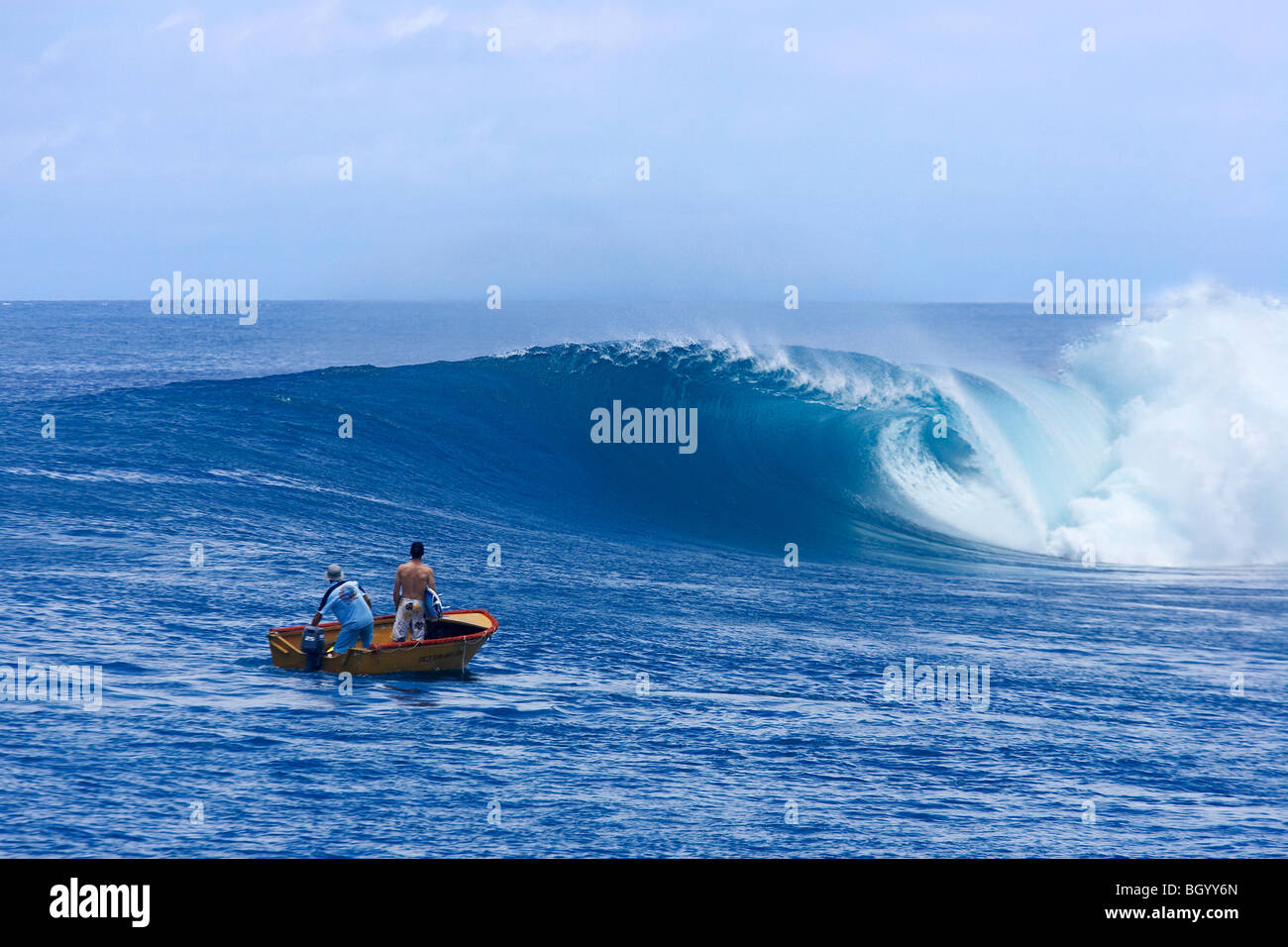 Heading out to surf by boat Stock Photo