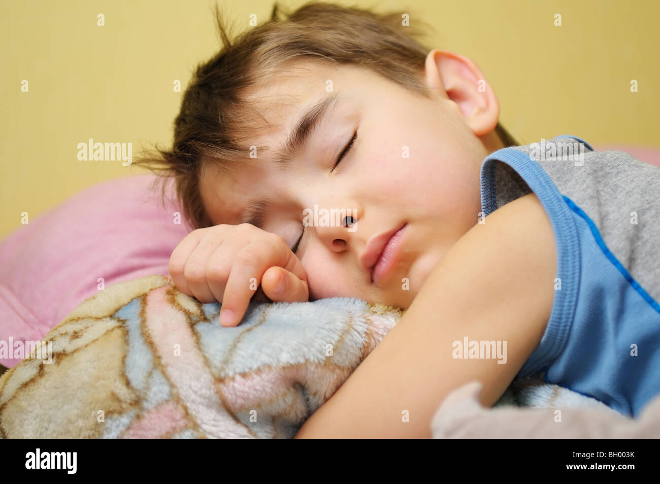 Five year old boy sleeping in his bed Stock Photo Alamy