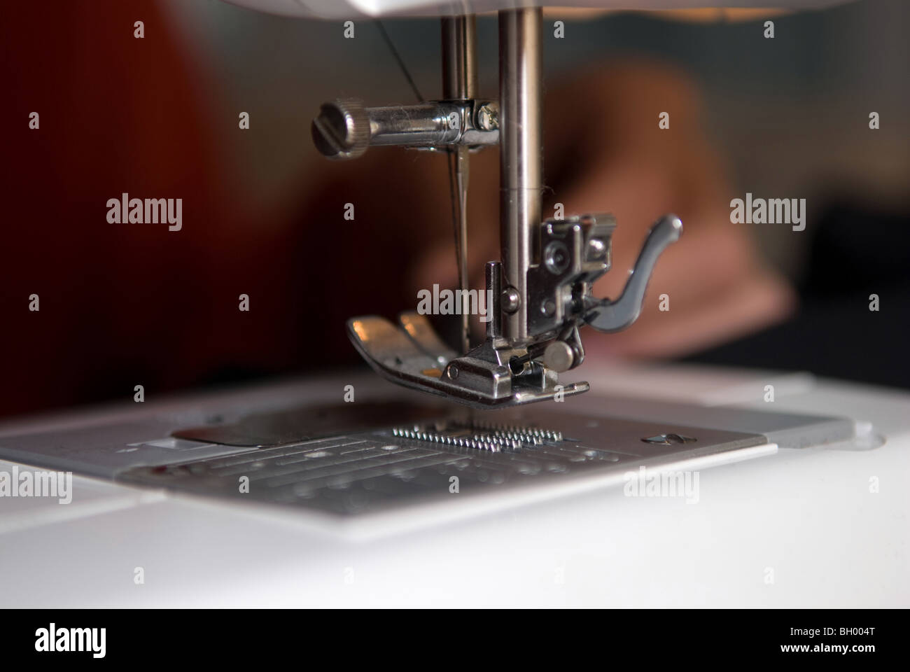Sewing hands Stock Photo