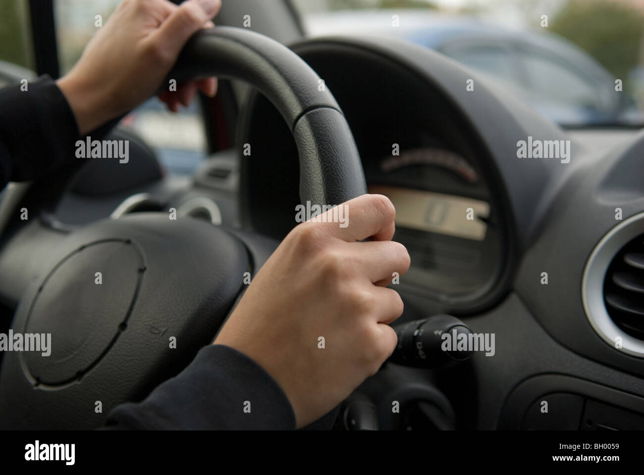Young woman driving her car Stock Photo