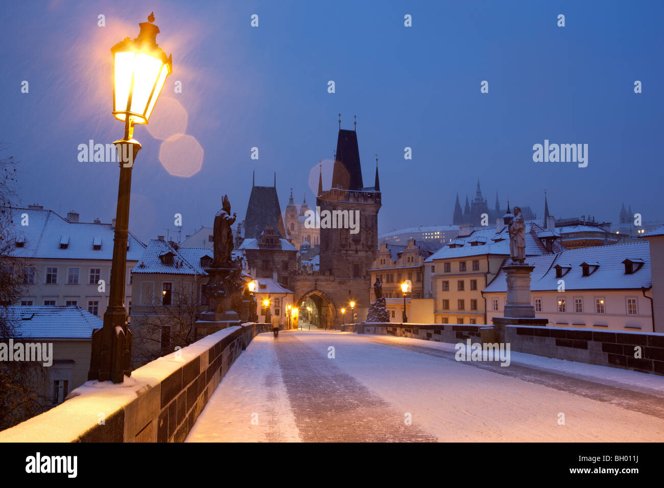 Charles Bridge. Looking towards the Hradcany district and Prague Castle in the snow Stock Photo