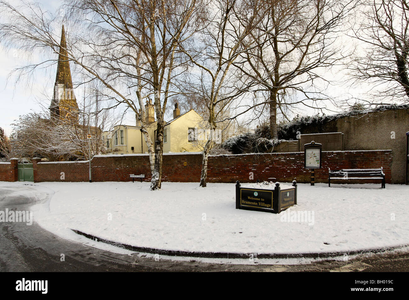Bramcote Village centre, Nottingham, in the winter snows. The spire of
