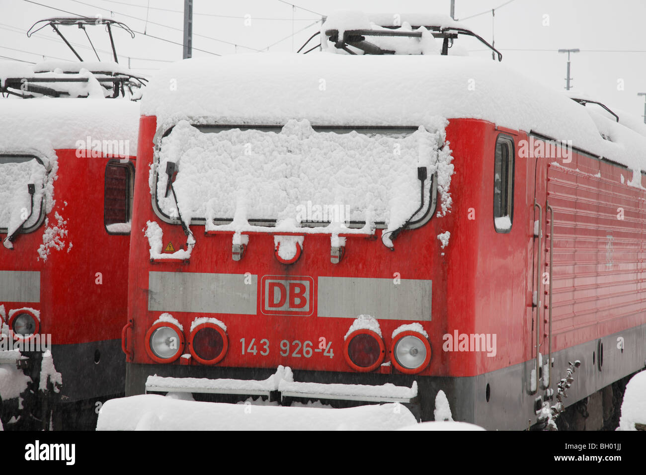 snow-covered electric railcars of German Railways Stock Photo