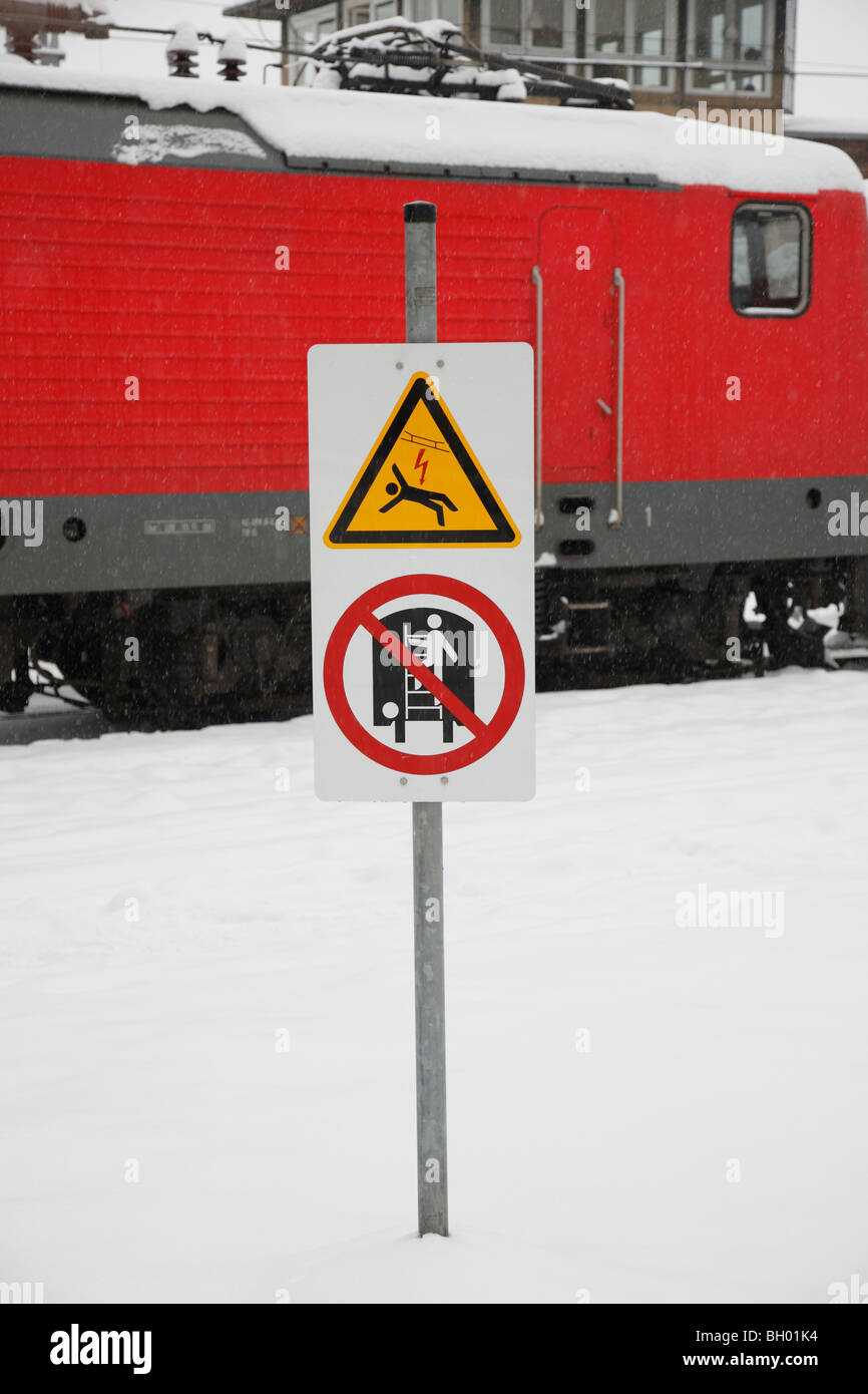 high voltage power sign; warning of climbing on trains Stock Photo