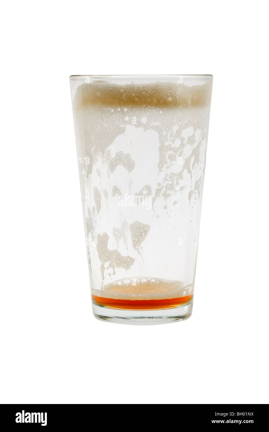 Empty pint glass with foam on white background Stock Photo