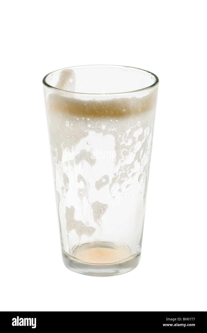 Empty pint glass with foam on white background Stock Photo