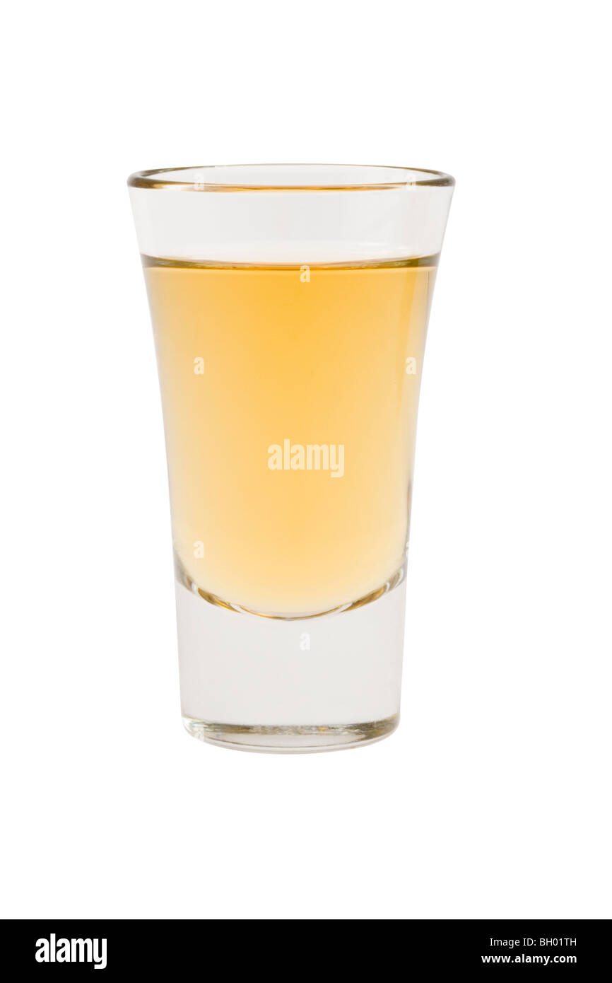 Whiskey neat in shot glass on white background Stock Photo