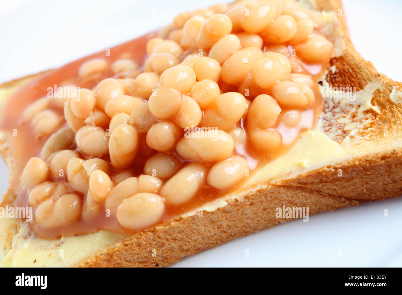 A plate with baked beans on toast seen close-up Stock Photo
