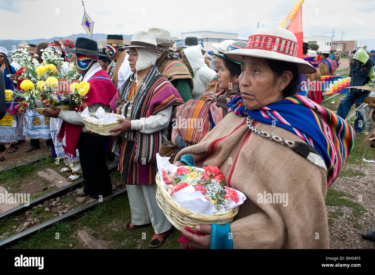 group of people with traditional aymara costumes in bolivia, Evo Morales presidential assumption, Tiwanaku ancient city. Stock Photo