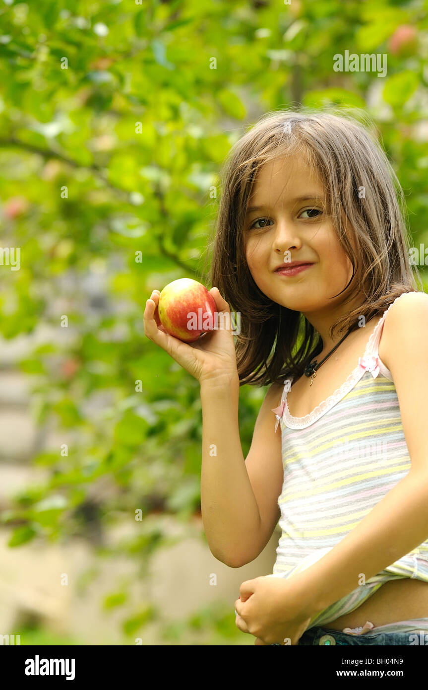 Girl with red apples in th garden Stock Photo