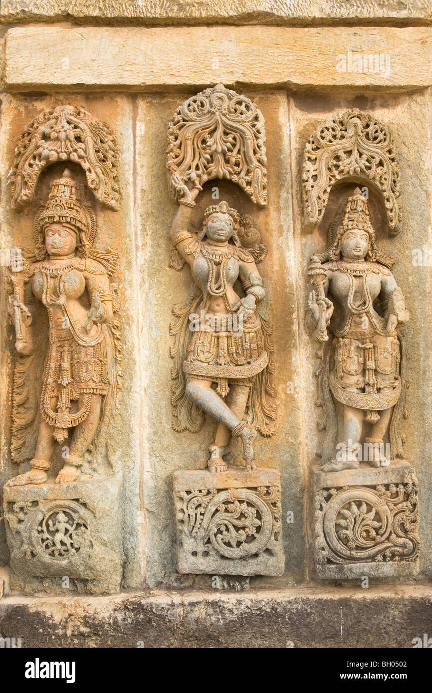 Female figures are sculpted onto a wall of the Chennakeshava Temple at Belur in Karnataka, India. Stock Photo