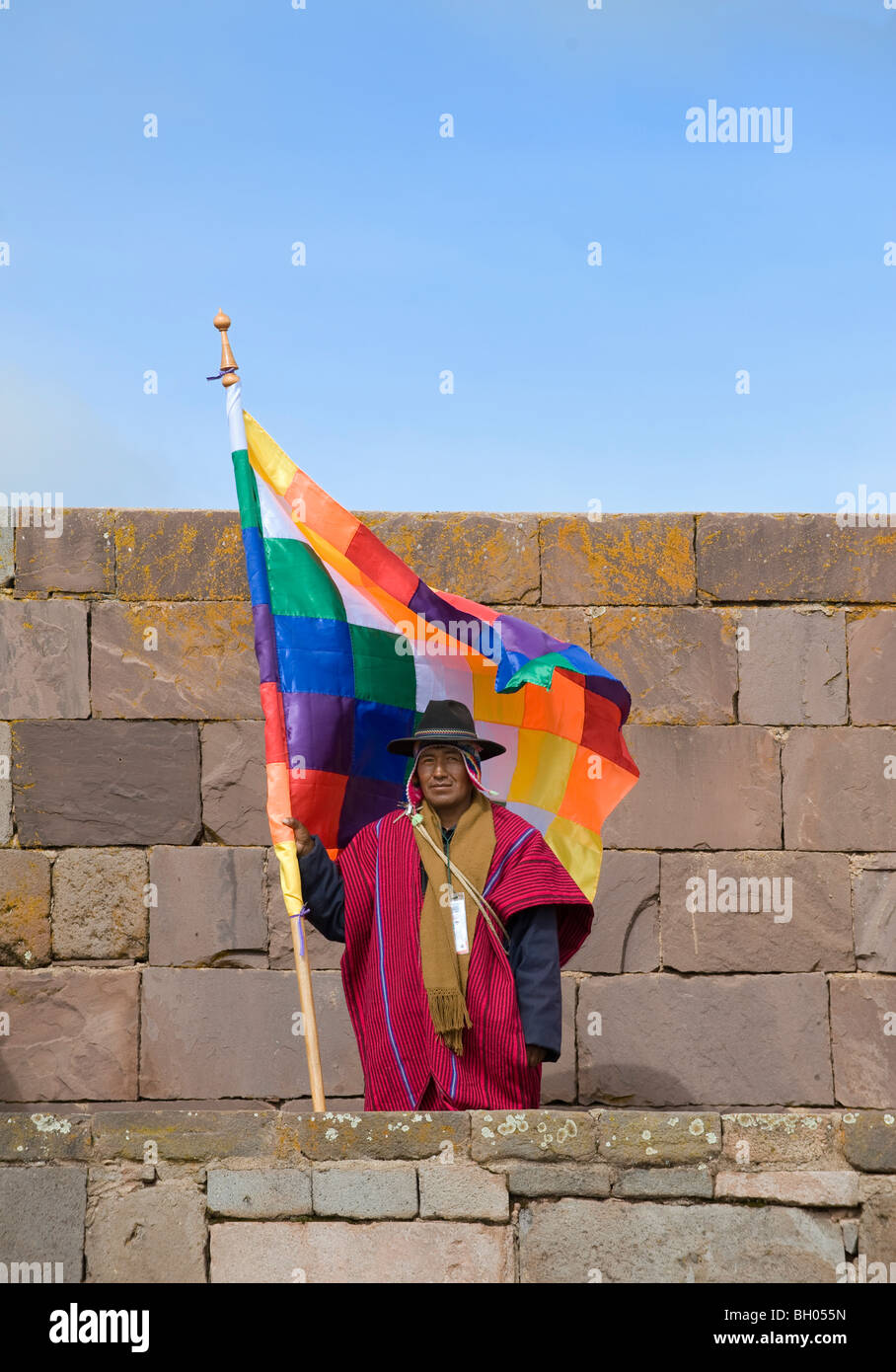 Tiwanaku temple, ceremony of Evo Morales Ayma second presidential assumption, Bolivia. Man with traditional dressing and flag. Stock Photo