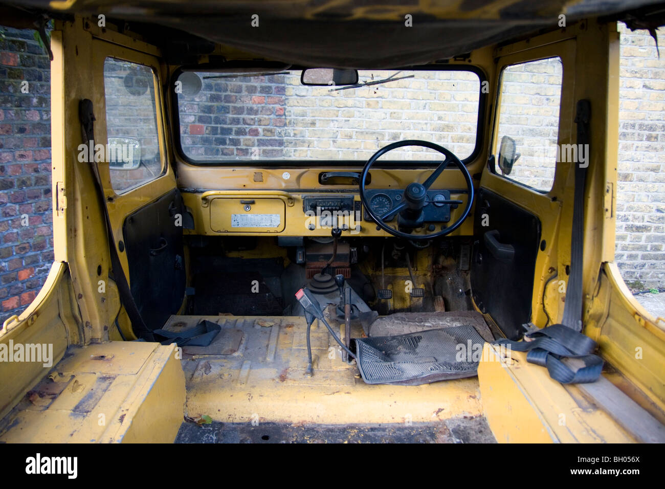 Old yellow jeep interior Stock Photo