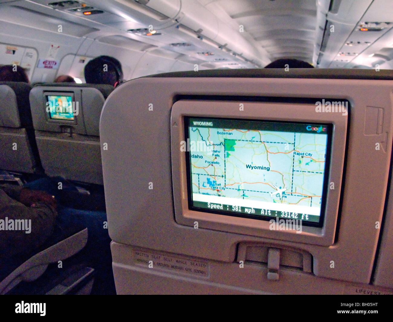 In-flight television entertainment for airline passengers' enjoyment on individual screens at their seats includes a flight map Stock Photo