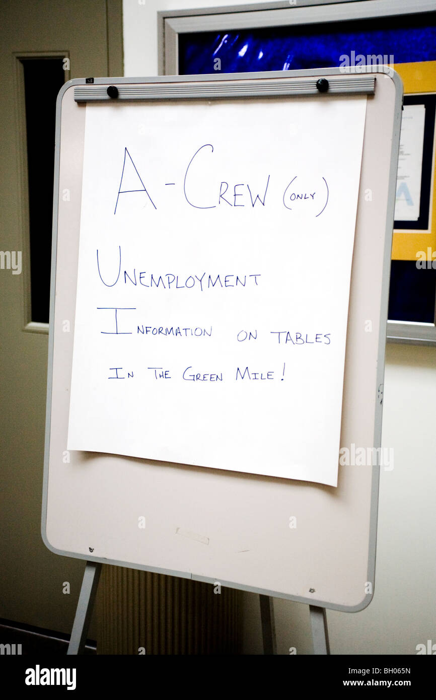 A sign announcing the availability of unemployment information greets exiting employees at an auto plant in Dearborn, MI. Stock Photo
