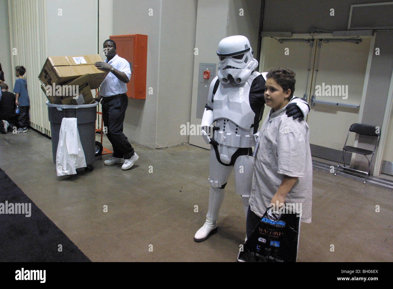 A boy poses for a photo with a Storm Trooper during Star Wars Celebration II at Sunday, May 6, 2002 in Indianapolis, Indiana. Stock Photo
