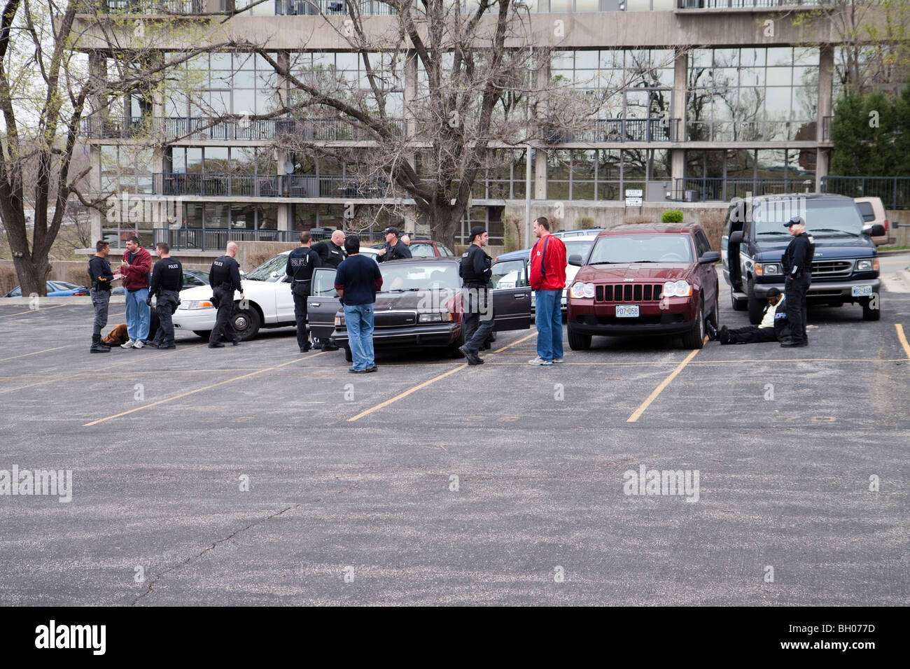 Police officers talking after arresting suspected drug dealers. Kansas City, MO, Police. Stock Photo