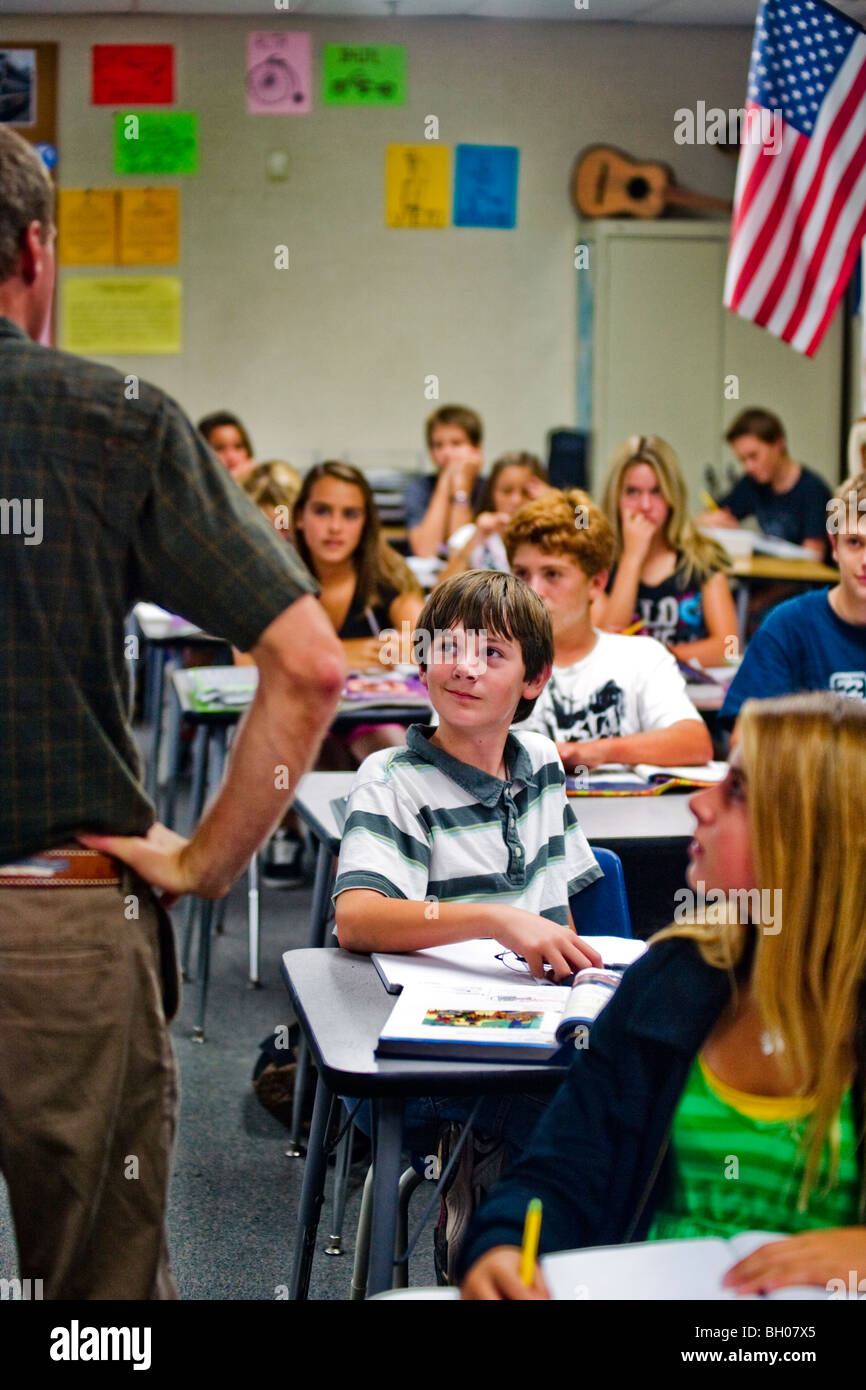 An eight-grade boy pays interested attention to his teacher at a Southern California middle school. Stock Photo
