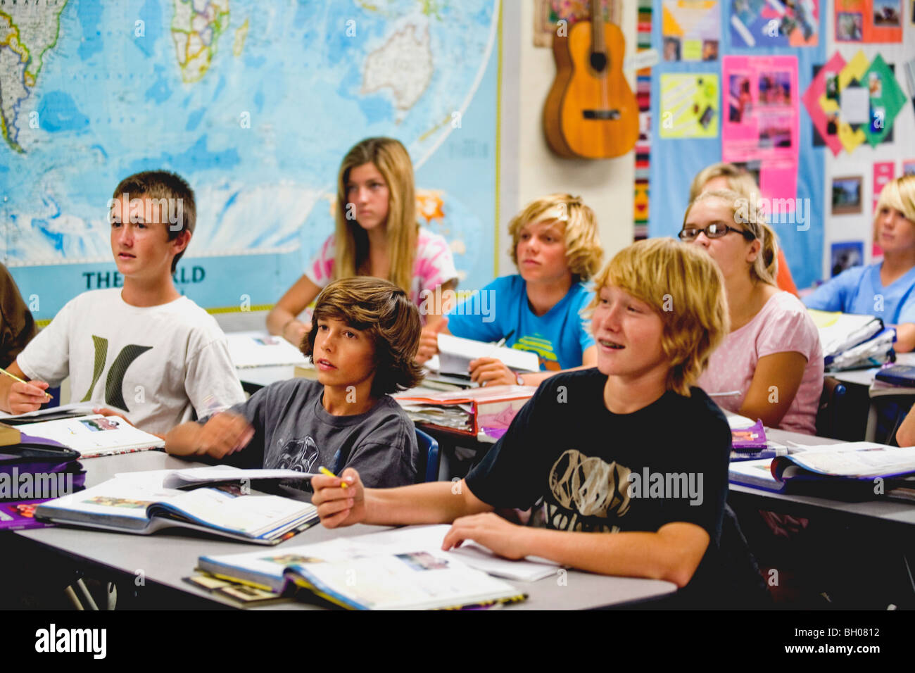 Enthusiastic eight-graders pay attention to their teacher in class at a Southern California middle school. Stock Photo