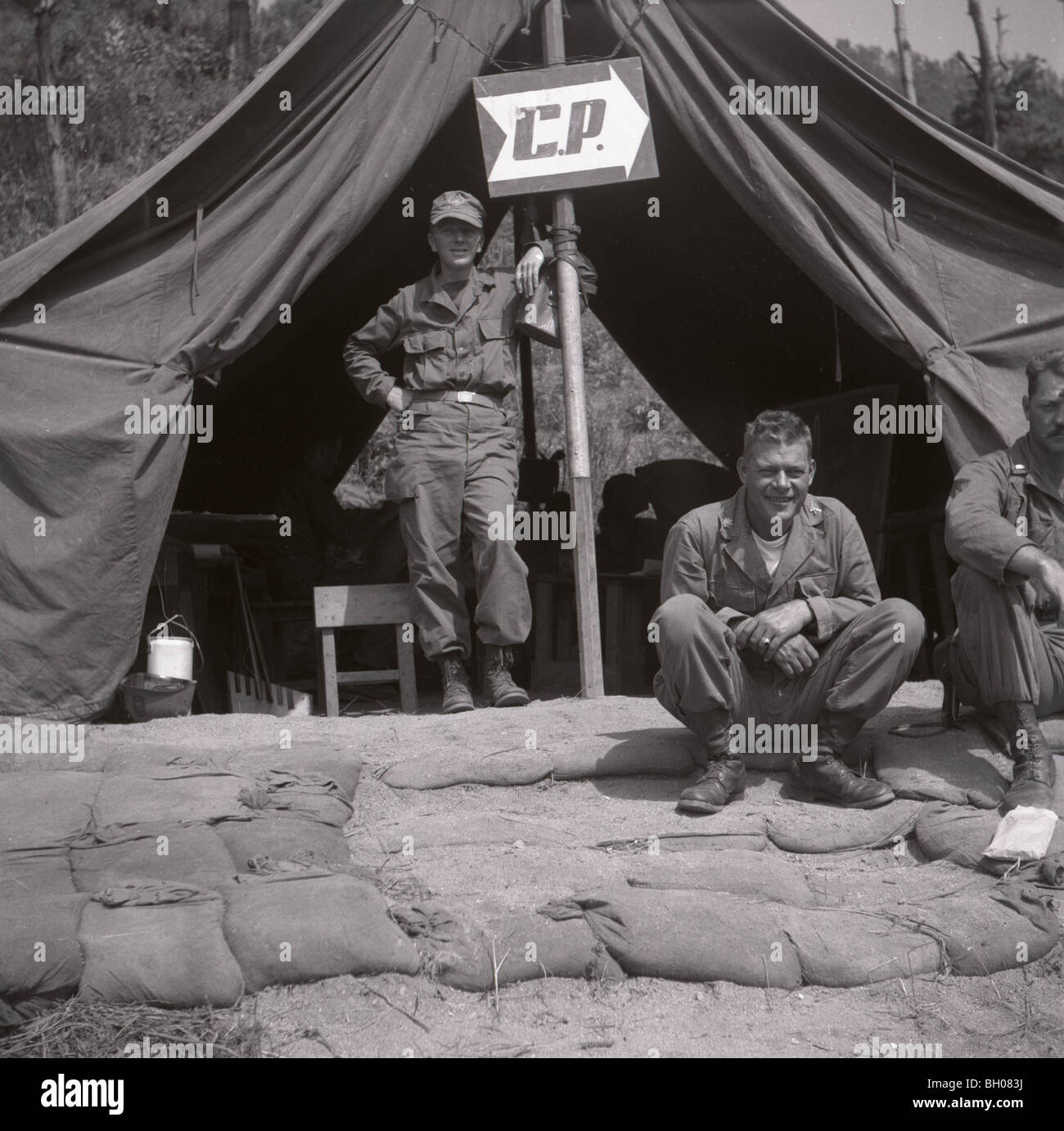 A Major, U.S. Army, Second Infantry Division, right, sits while a captain stands at the Korean War 2nd Infantry Division HQ Stock Photo