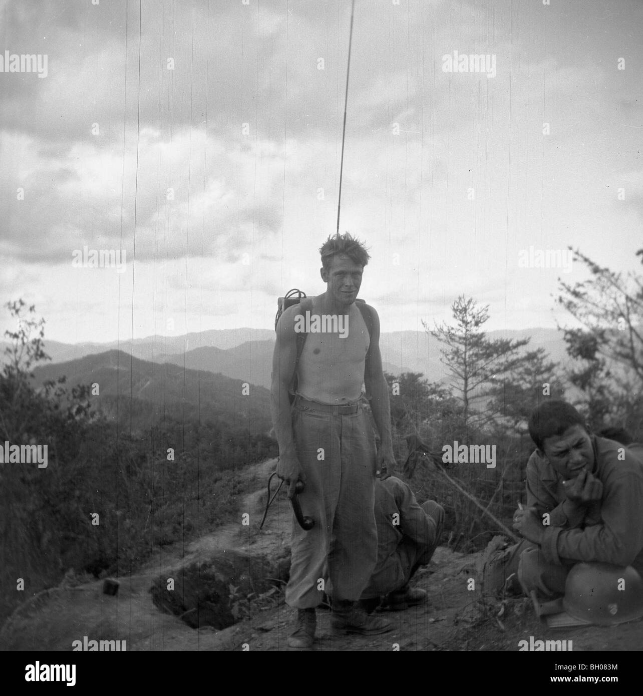 A member of the Second Infantry Division stands with a radio and