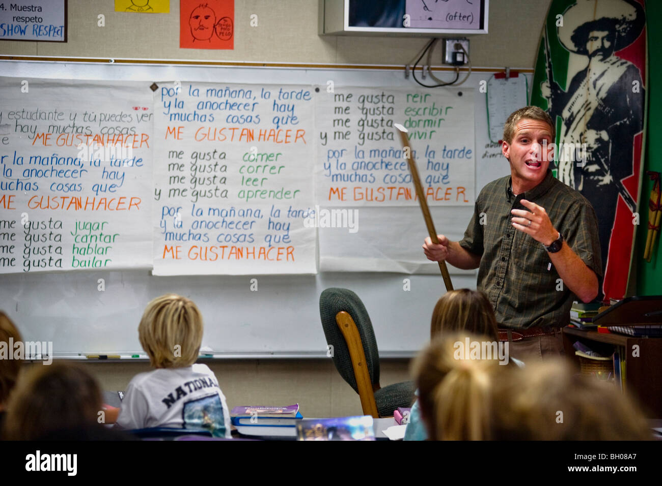 An enthusiastic middle school Spanish teacher conducts his eight-grade class at a Southern California middle school. Stock Photo