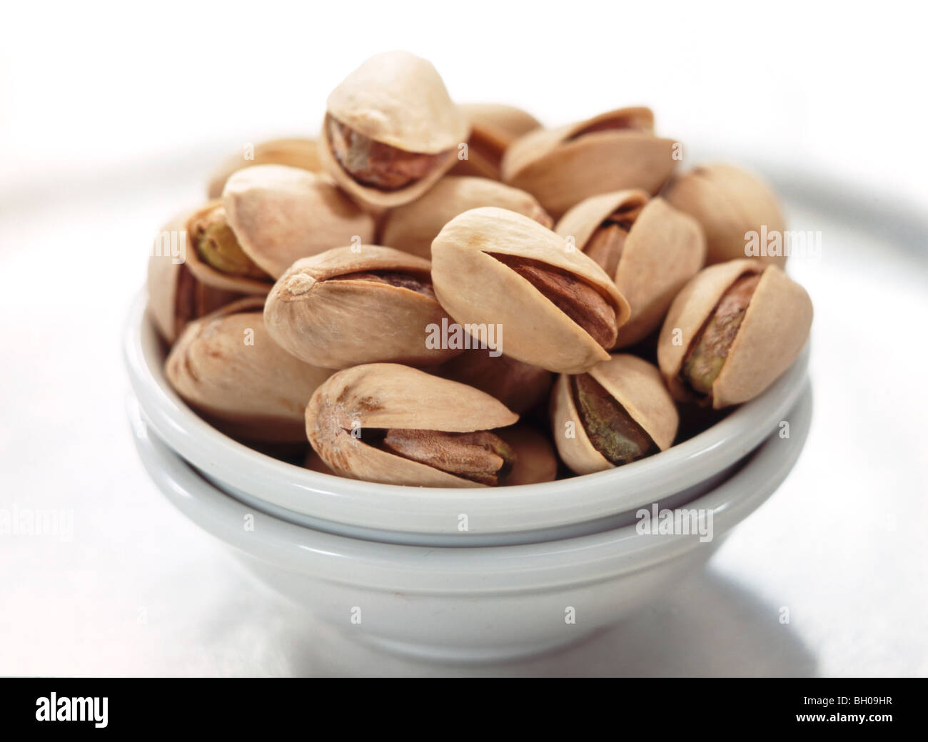 small bowl of pistachio nuts Stock Photo