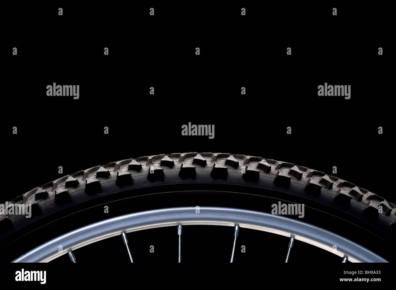 Mountain bike tire and rim on black with copy space Stock Photo