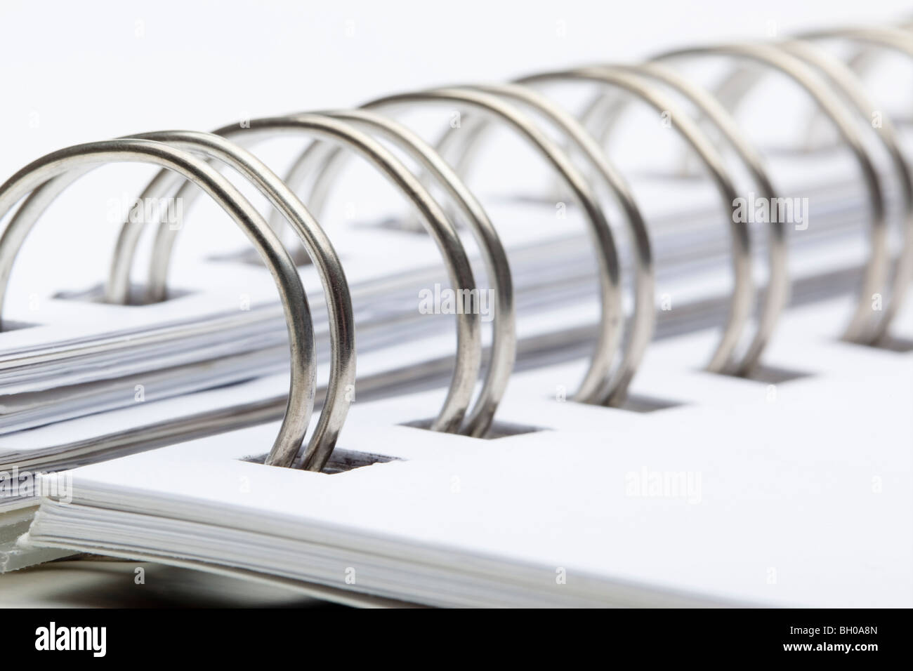 extreme closeup of a spiral notebook on white Stock Photo
