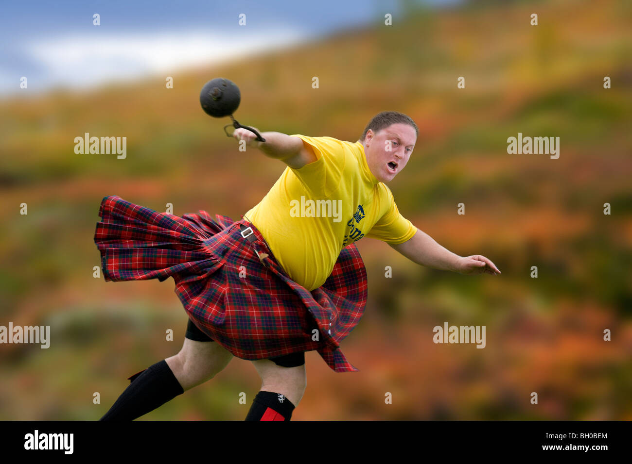 Sportsman 'Throwing the Hammer' at the Highland Games in Scotland Stock Photo